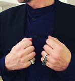 SIGNET ring, TRIP ring, and WALL ring stacked with wedding band