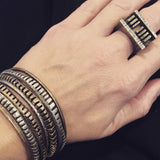 WALL (sterling silver) and MOAT THIN (bronze) rings, GEAR and MIN bangles (sterling silver, bronze)